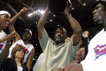 AUBURN HILLS, MI - JUNE 1:  (L-R) Chauncey Billups #1, Rasheed Wallace #30, President of Basketball Operations Joe Dumars (holding trophy) and Ben Wallace #3 of the Detroit Pistons celebrate their win over the Indiana Pacers in Game six of the Eastern Conference Finals during the 2004 NBA Playoffs at The Palace of Auburn Hills on June 1, 2004 in Auburn Hills, Michigan.  The Pistons defeated the Pacers 69-65 and won the 2004 Eastern Conference Championship.  NOTE TO USER: User expressly acknowledges and agrees that, by downloading and/or using this Photograph, user is consenting to the terms and conditions of the Getty Images License Agreement. (Photo by Tom Pidgeon/Getty Images)