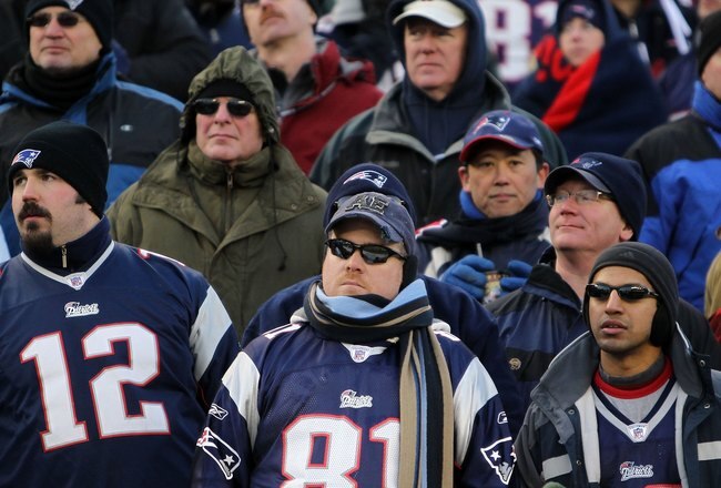 FOXBORO, MA - JANUARY 10:  Fans of the New England Patriots look on dejected from the stands late in the second half against the Baltimore Ravens during the 2010 AFC wild-card playoff game at Gillette Stadium on January 10, 2010 in Foxboro, Massachusetts.  (Photo by Jim Rogash/Getty Images)