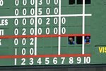 CHICAGO - AUGUST 30: Workers in the scoreboard look at fans in the center field bleachers during a game between  the Chicago Cubs and the New York Mets on August 30, 2009 at Wrigley Field in Chicago, Illinois.  The Mets defeated the Cubs 4-1. (Photo by Jonathan Daniel/Getty Images)