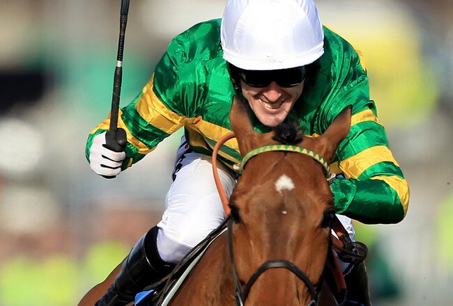 CHELTENHAM, ENGLAND - MARCH 16:  Binocular ridden by Tony McCoy en-route to winning The Smurfit Kappa Champion Hurdle Challenge Trophy on Day One of the Cheltenham Festival on March 16, 2010 in Cheltenham, England.  (Photo by Warren Little/Getty Images)