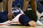 OAKLAND, CA - MARCH 23:  Arron Afflalo #4 of the UCLA Bruins consoles Adam Morrison #3 of the the Gonzaga Bulldogs after losing in the third round game of the NCAA Division I Men's Basketball Tournament at the Arena in Oakland on March 23, 2006 in Oakland, California.  The Bruins defeated the Bulldogs 73-71.  (Photo by Jed Jacobsohn/Getty Images)
