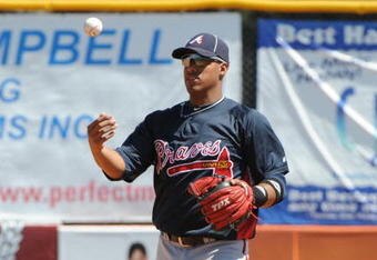 DUNEDIN, FL - MARCH 14: Infielder Yunel Escobar #19 of the  Atlanta Braves flips a baseball after a put out against the Toronto Blue Jays March 14, 2010 at the Dunedin Stadium in Dunedin, Florida. (Photo by Al Messerschmidt/Getty Images)
