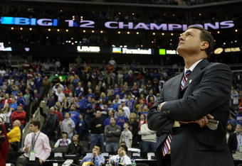 KANSAS CITY, MO - MARCH 13:  Head coach Bill Self of the Kansas Jayhawks watches highlights on the videoboard after the Jayhawks defeated the Kansas State Wildcats to win the 2010 Phillips 66 Big 12 Men's Basketball Championship on March 13, 2010 at the Sprint Center in Kansas City, Missouri.  (Photo by Jamie Squire/Getty Images)