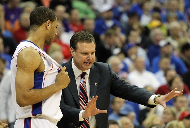 KANSAS CITY, MO - MARCH 13:  Head coach Bill Self of the Kansas Jayhawks instructs Xavier Henry #1 during the 2010 Phillips 66 Big 12 Men's Basketball Championship agaisnt the Kansas State Wildcats on March 13, 2010 at the Sprint Center in Kansas City, Missouri.  (Photo by Jamie Squire/Getty Images)