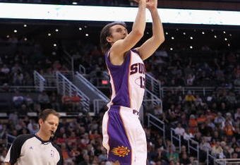 PHOENIX - MARCH 14:  Steve Nash #13 of the Phoenix Suns puts up a three point shot against the New Orleans Hornets during the NBA game at US Airways Center on March 14, 2010 in Phoenix, Arizona. The Suns defeated the Hornets 120-106.  NOTE TO USER: User expressly acknowledges and agrees that, by downloading and or using this photograph, User is consenting to the terms and conditions of the Getty Images License Agreement.  (Photo by Christian Petersen/Getty Images)