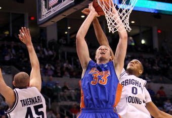 OKLAHOMA CITY - MARCH 18: Erik Murphy #33 of the Florida Gators drives for a shot attempt against Brandon Davies #0 of the BYU Cougars during the first round of the 2010 NCAA men�s basketball tournament at Ford Center on March 18, 2010 in Oklahoma City, Oklahoma.  (Photo by Ronald Martinez/Getty Images)