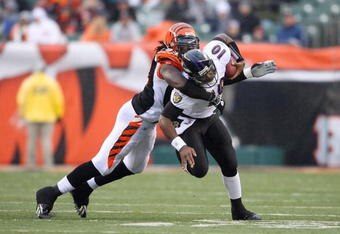 CINCINNATI - NOVEMBER 30:  Rashad Jeany #93 of the Cincinnati Bengals tackles quarterback Troy Smith #16 of the Baltimore Raven during their NFL game on November 30, 2008 at Paul Brown Stadium in Cincinnati, Ohio. The Ravens defeated the Bengals 34-3.(Photo by Andy Lyons/Getty Images)