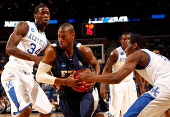 NEW ORLEANS - MARCH 18:  Justin Tubbs #3 of the East Tennessee State Buccaneers has the ball stripped from him by John Wall #11 of the Kentucky Wildcats during the first round of the 2010 NCAA men's basketball tournament at the New Orleans Arena on March 18, 2010 in New Orleans, Louisiana.  (Photo by Chris Graythen/Getty Images)