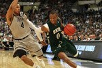 PROVIDENCE, RI - MARCH 18:  Armon Bassett #0 of the Ohio Bobcats drives to the net as Chris Wright #4 of the Georgetown Hoyas defends during the first round of the 2010 NCAA men's basketball tournament on March 18, 2010 at the Dunkin Donuts Arena in Providence, Rhode Island. Ohio defeated Georgetown 97-83.  (Photo by Elsa/Getty Images)