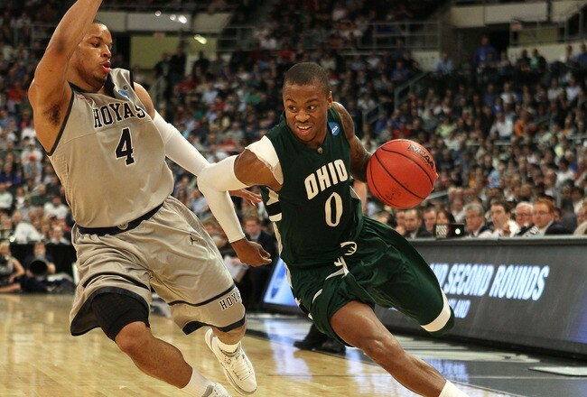 PROVIDENCE, RI - MARCH 18:  Armon Bassett #0 of the Ohio Bobcats drives to the net as Chris Wright #4 of the Georgetown Hoyas defends during the first round of the 2010 NCAA men's basketball tournament on March 18, 2010 at the Dunkin Donuts Arena in Providence, Rhode Island. Ohio defeated Georgetown 97-83.  (Photo by Elsa/Getty Images)