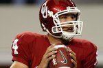 ARLINGTON, TX - SEPTEMBER 05:  Quarterback Sam Bradford #14 of the Oklahoma Sooners drops back to pass against the Brigham Young Cougars at Cowboys Stadium on September 5, 2009 in Arlington, Texas.  (Photo by Ronald Martinez/Getty Images)