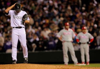 DENVER - OCTOBER 12:  Pitcher Huston Street #16 of the Colorado Rockies reacts as he returns to the mound after giving up the game winning RBI single to Jayson Werth #28 (R) of the Philadelphia Phillies in the ninth inning in Game Four of the NLDS during the 2009 MLB Playoffs at Coors Field on October 12, 2009 in Denver, Colorado. The Phillies defeated the Rockies 5-4 to advance to the National League Championship Series.  (Photo by Doug Pensinger/Getty Images)