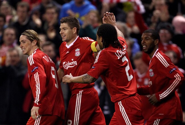 LIVERPOOL, ENGLAND - MARCH 18:  Steven Gerrard of Liverpool celebrates scoring the opening goal from the penalty spot with his team mates during the UEFA Europa League Round of 16, second leg match at Anfield on March 18, 2010 in Liverpool, England.  (Photo by Alex Livesey/Getty Images)