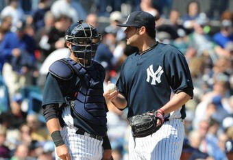 TAMPA, FL - MARCH 5: Pitcher Joba Chamberlain #62 of the New York Yankees talks with catcher Francisco Cervelli #29 after taking the mound in relief against the Tampa Bay Rays March 5, 2010 at the George M. Steinbrenner  Field in Tampa, Florida. (Photo by Al Messerschmidt/Getty Images)
