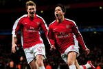 LONDON, ENGLAND - MARCH 09:  Samir Nasri (R) of Arsenal celebrates with teammate Nicklas Bendtner after scoring his team's third goal during the UEFA Champions League round of 16 match between Arsenal and FC Porto at the Emirates Stadium on March 9, 2010 in London, England.  (Photo by Mike Hewitt/Getty Images)