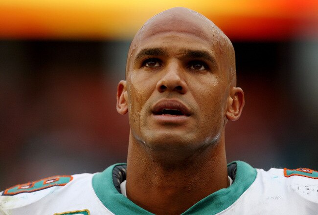MIAMI - JANUARY 03:  Linebacker Jason Taylor #99 of the Miami Dolphins looks up as the last few moments of the game tick away against the Pittsburgh Steelers calls out a play at the line of scrimmage at Land Shark Stadium on January 3, 2010 in Miami, Florida. The Steelers defeated the Dolphins 30-24.  (Photo by Doug Benc/Getty Images)