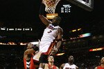 MIAMI - NOVEMBER 19:  Dwyane Wade #3 of the Miami Heat dunks over Chris Bosh #4 of the Toronto Raptors at American Airlines Arena on November 19, 2008 in Miami, Florida. The Raptors defeated the Heat 101-95. NOTE TO USER: User expressly acknowledges and agrees that, by downloading and/or using this Photograph, user is consenting to the terms and conditions of the Getty Images License Agreement.  (Photo by Doug Benc/Getty Images)