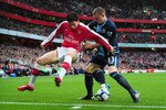 LONDON, ENGLAND - MARCH 20:  Samir Nasri of Arsenal is challenged by Fabio Daprela of West Ham United during the Barclays Premier League match between Arsenal and West Ham United at Emirates Stadium on March 20, 2010 in London, England.  (Photo by Mike Hewitt/Getty Images)