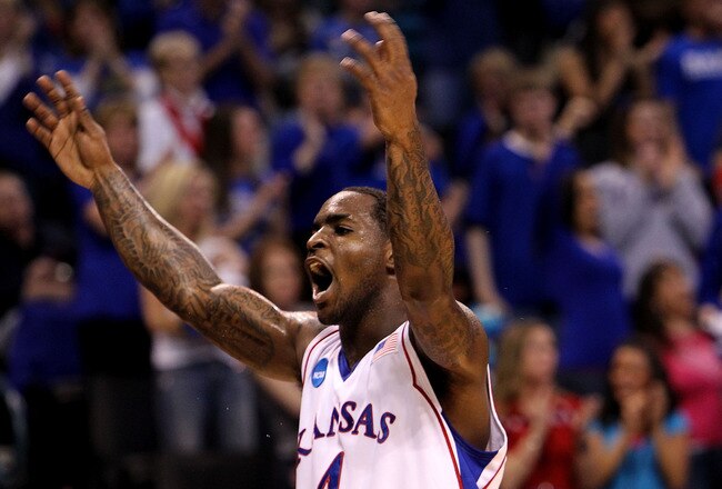 OKLAHOMA CITY - MARCH 18:  Sherron Collins #4 of the Kansas Jayhawks reacts against the Lehigh Mountain Hawks during the first round of the 2010 NCAA men's basketball tournament at Ford Center on March 18, 2010 in Oklahoma City, Oklahoma.  (Photo by Ronald Martinez/Getty Images)