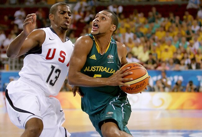 BEIJING - AUGUST 20:  Patrick Mills #5 of Australia drives to the basket over Chris Paul #13 of the United States during the men's basketball quarterfinal game at the Olympic Basketball Gymnasium during Day 12 of the Beijing 2008 Olympic Games on August 20, 2008 in Beijing, China.  (Photo by Streeter Lecka/Getty Images)