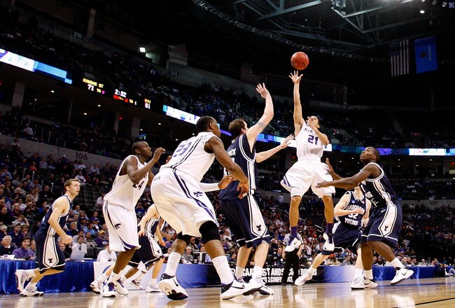 OKLAHOMA CITY - MARCH 20:  Denis Clemente #21 of the Kansas State Wildcats attempts a shot against the Brigham Young Cougars during the second round of the 2010 NCAA men's basketball tournament at Ford Center on March 20, 2010 in Oklahoma City, Oklahoma.  (Photo by Ronald Martinez/Getty Images)