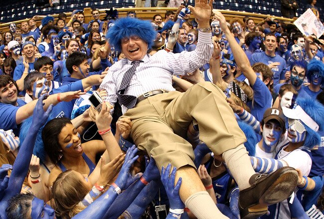 DURHAM, NC - MARCH 06:  ESPN analyst Dick Vitale surfs the crowd with the Cameron Crazies before the start of the game between the North Carolina Tar Heels and Duke Blue Devils at Cameron Indoor Stadium on March 6, 2010 in Durham, North Carolina.  (Photo by Streeter Lecka/Getty Images)