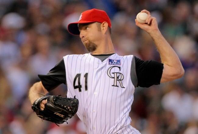 DENVER - JULY 04:  Relief pitcher Alan Embree #41 of the Colorado Rockies delivers against the Arizona Diamondbacks during MLB action at Coors Field on July 4, 2009 in Denver, Colorado. The Diamondbacks defeated the Rockies 11-7.  (Photo by Doug Pensinger/Getty Images)