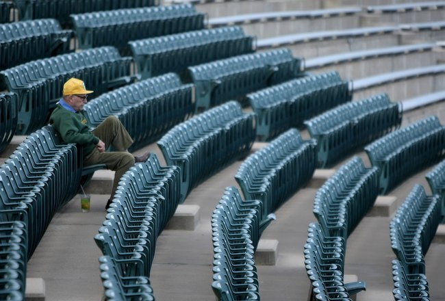 FORT COLLINS, CO - NOVEMBER 01:  A lone fan takes his seat as the Brigham Young Cougars and the Colorado State Rams take the field to warm up prior to the game at Sonny Lubick Field at Hughes Stadium on November 1, 2008 in Fort Collins, Colorado. BYU defeated CSU 45-42.  (Photo by Doug Pensinger/Getty Images)
