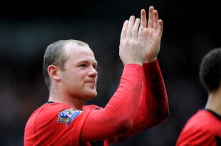 MANCHESTER, ENGLAND - MARCH 21: Wayne Rooney of Manchester United applauds the fans after the Barclays Premier League match between Manchester United and Liverpool at Old Trafford on March 21, 2010 in Manchester, England.  (Photo by Michael Regan/Getty Images)
