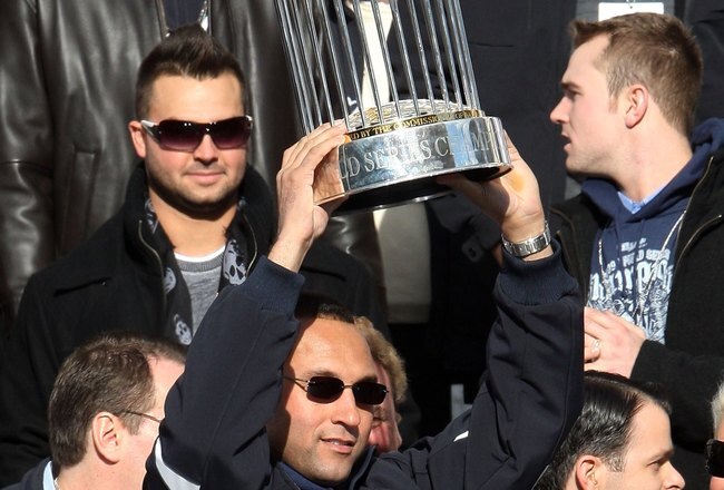 NEW YORK - NOVEMBER 06:  Captain Derek Jeter #2 of the New York Yankees celebrates with the championship trophy during the New York Yankees World Series Victory Celebration at City Hall on November 6, 2009 in New York, New York.  (Photo by Jim McIsaac/Getty Images)