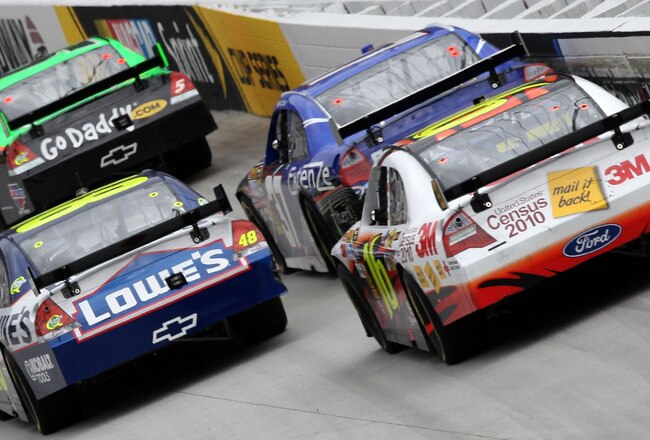 BRISTOL, TN - MARCH 21:  Mark Martin, driver of the #5 GoDaddy.com Chevrolet, leads Jimmie Johnson, driver of the #48 Lowe's Chevrolet, Kevin Conway, driver of the #37 Extenze Ford, and Greg Biffle, driver of the #16 US Census Ford,during the NASCAR Sprint Cup Series Food City 500 at Bristol Motor Speedway on March 21, 2010 in Bristol, Tennessee.  (Photo by Doug Pensinger/Getty Images)