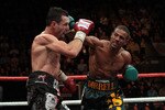 NOTTINGHAM, ENGLAND - OCTOBER 17:  Carl Froch (L) is caught by a right cross in his title against Andre Dirrell during their WBC Super Middleweight fight on October 17, 2009 at Trent FM Arena in Nottingham, England.  (Photo by John Gichigi/Getty Images)
