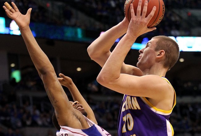 OKLAHOMA CITY - MARCH 20:  Jake Koch #20 of the Northern Iowa Panthers drives for a shot attempt against Marcus Morris #22 of the Kansas Jayhawks during the second round of the 2010 NCAA men's basketball tournament at Ford Center on March 20, 2010 in Oklahoma City, Oklahoma.  (Photo by Ronald Martinez/Getty Images)