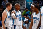 NEW ORLEANS - MARCH 08:  Darius Songalia #9, David West #30, James Posey #41 and Marcus Thornton #5 of the New Orleans Hornets talk during a timeout against the Golden State Warriors at New Orleans Arena on March 8, 2010 in New Orleans, Louisiana.  The Hornets defeated the Warriors 135-131.  NOTE TO USER: User expressly acknowledges and agrees that, by downloading and/or using this Photograph, User is consenting to the terms and conditions of the Getty Images License Agreement.  (Photo by Chris Graythen/Getty Images)