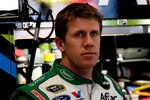 ATLANTA - MARCH 05:  Carl Edwards, driver of the #99 Scotts Ford, stands in the garage during practice for the NASCAR Sprint Cup Series Kobalt Tools 500 at Atlanta Motor Speedway on March 5, 2010 in Hampton, Georgia.  (Photo by Tom Whitmore/Getty Images for NASCAR)