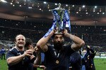 PARIS - MARCH 20:  Sebastien Chabal of France holds the trophy with team mate William Servat after France completed the Grand Slam during the RBS Six Nations Championship match between France and England at the Stade de France on March 20, 2010 in Paris, France.  (Photo by David Rogers/Getty Images)