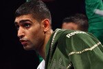 NEWCASTLE UPON TYNE, ENGLAND - DECEMBER 05:  Amir Khan gets ready before his fight against Dmitriy Salita of the U.S. for the WBA Light Welterweight title on December 5, 2009 in Newcastle upon Tyne, England.  (Photo by John Gichigi/Getty Images)