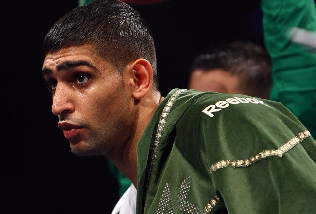 NEWCASTLE UPON TYNE, ENGLAND - DECEMBER 05:  Amir Khan gets ready before his fight against Dmitriy Salita of the U.S. for the WBA Light Welterweight title on December 5, 2009 in Newcastle upon Tyne, England.  (Photo by John Gichigi/Getty Images)