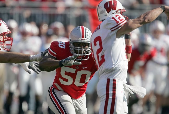 COLUMBUS, OH - NOVEMBER 03: Vernon Gholston #50 of the Ohio State Buckeyes looks to sack Tyler Donovan #12 of the Wisconsin Badgers on November 3, 2007 at Ohio Stadium in Columbus, Ohio. Ohio State defeated Wisconsin 38-17. (Photo by Jonathan Daniel/Getty Images) 
