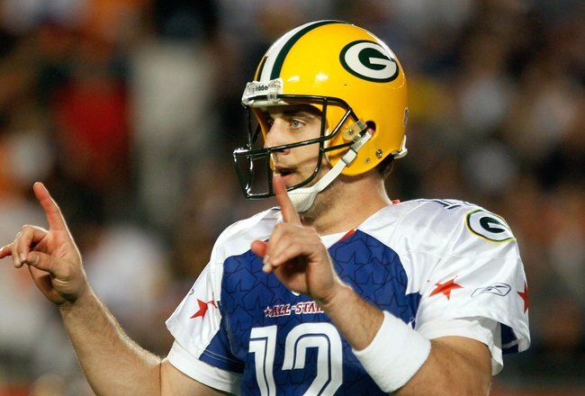 MIAMI GARDENS, FL - JANUARY 31:  Aaron Rodgers #12 of the NFC's Green Bay Packers signals a play during the 2010 AFC-NFC Pro Bowl game at Sun Life Stadium on January 31, 2010 in Miami Gardens, Florida. The AFC defeated the NFC 41-34. (Photo by Scott Halleran/Getty Images)
