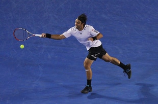 MELBOURNE, AUSTRALIA - JANUARY 24:  Fernando Gonzalez of Chile plays a forehand in his fourth round match against Andy Roddick of the United States of America during day seven of the 2010 Australian Open at Melbourne Park on January 24, 2010 in Melbourne, Australia.  (Photo by Ryan Pierse/Getty Images)