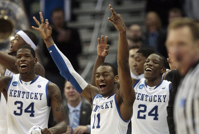 NEW ORLEANS - MARCH 20:  John Wall #11 of the Kentucky Wildcats celebrates during the second round of the 2010 NCAA men's basketball tournament at the New Orleans Arena on March 20, 2010 in New Orleans, Louisiana.  (Photo by Dave Martin/Getty Images) 