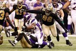 NEW ORLEANS - JANUARY 24:  Remi Ayodele #92 of the New Orleans Saints defends against the Minnesota Vikings during the NFC Championship Game at the Louisiana Superdome on January 24, 2010 in New Orleans, Louisiana. The Saints won 31-28 in overtime. (Photo by Chris Graythen/Getty Images)