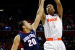 BUFFALO, NY - MARCH 21:  Wes Johnson #4 of the Syracuse Orange shoots the ball against Elias Harris #20 of the Gonzaga Bulldogs during the second round of the 2010 NCAA men's basketball tournament at HSBC Arena at HSBC Arena on March 21, 2010 in Buffalo, New York.  (Photo by Michael Heiman/Getty Images)