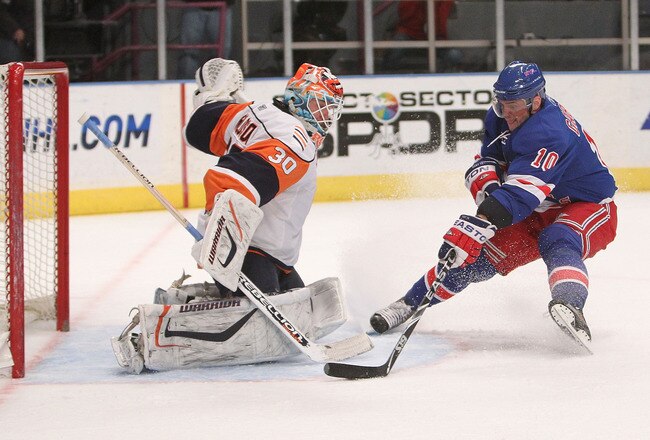 NEW YORK - MARCH 24:  Marian Gaborik #10 of the New York Rangers has his breakaway shot saved by Dwayne Roloson #30 of the New York Islanders at Madison Square Garden on March 24, 2010 in New York City.  (Photo by Nick Laham/Getty Images)