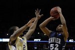 MILWAUKEE - MARCH 21:  Terrell Holloway #52 of the Xavier Musketeers shoots over Brad Wanamaker #22 of the Pittsburgh Panthers in the second half during the second round of the 2010 NCAA men's basketball tournament at the Bradley Center on March 21, 2010 in Milwaukee, Wisconsin.  (Photo by Jonathan Daniel/Getty Images)
