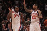 NEW YORK - JANUARY 28:  Al Harrington #7 of the New York Knicks celebrates a basket with teammate Wilson Chandler #21 against the Toronto Raptors at Madison Square Garden on January 28, 2010 in New York, New York. NOTE TO USER: User expressly acknowledges and agrees that, by downloading and or using this photograph, User is consenting to the terms and conditions of the Getty Images License Agreement.  (Photo by Nick Laham/Getty Images)