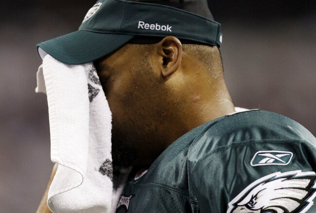 ARLINGTON, TX - JANUARY 9:  Quarterback Donovan McNabb #5 of the Philadelphia Eagles wipes his face from the sideline in the second quarter against the Dallas Cowboys during the 2010 NFC wild-card playoff game at Cowboys Stadium on January 9, 2010 in Arlington, Texas. (Photo by Jamie Squire/Getty Images)