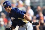 SCOTTSDALE, AZ - MARCH 04:  Carlos Gomez #27 of the Milwaukee Brewers runs to second base against the San Francisco Giants during a spring training game at Scottsdale Stadium on March 4, 2010 in Scottsdale, Arizona.  (Photo by Chris McGrath/Getty Images)