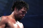 ARLINGTON, TX - MARCH 13:  Manny Pacquiao of the Philippines looks on in the ring against Joshua Clottey of Ghana during the WBO welterweight title fight at Cowboys Stadium on March 13, 2010 in Arlington, Texas. Pacquiao defeated Clottey by unanimous decision.  (Photo by Jed Jacobsohn/Getty Images)